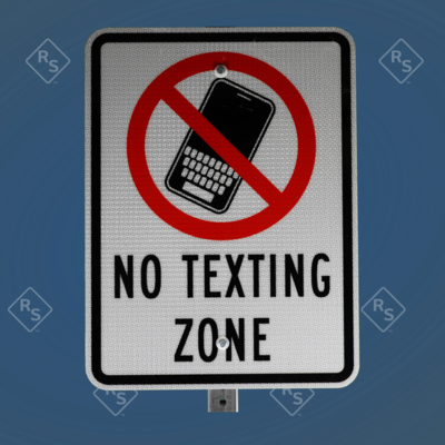 A 360 degree view a sign reads No Texting Zone in black letters with a large red slash and a black phone