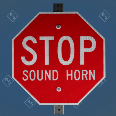 A 360 degree view of a sign that tells people to stop and sound the horn