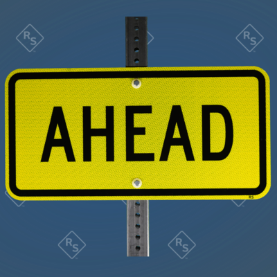A 360 degree view a sign that has the word Ahead printed in black letters on a yellow or lime colored sign