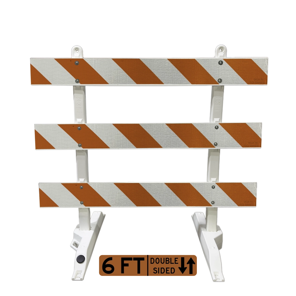 A detailed product photograph of a fully assembled 6-foot double-sided Type III barricade coated in full cube ultra prismatic reflective sheeting across all three horizontal rails. Vivid alternating orange and white retroreflective diagonal stripes adorn both faces of each panel, supported by white plastic collapsible A-frame uprights, delivering unmatched reflective brilliance for temporary roadway blockades and traffic rerouting in demanding work zone environments.
