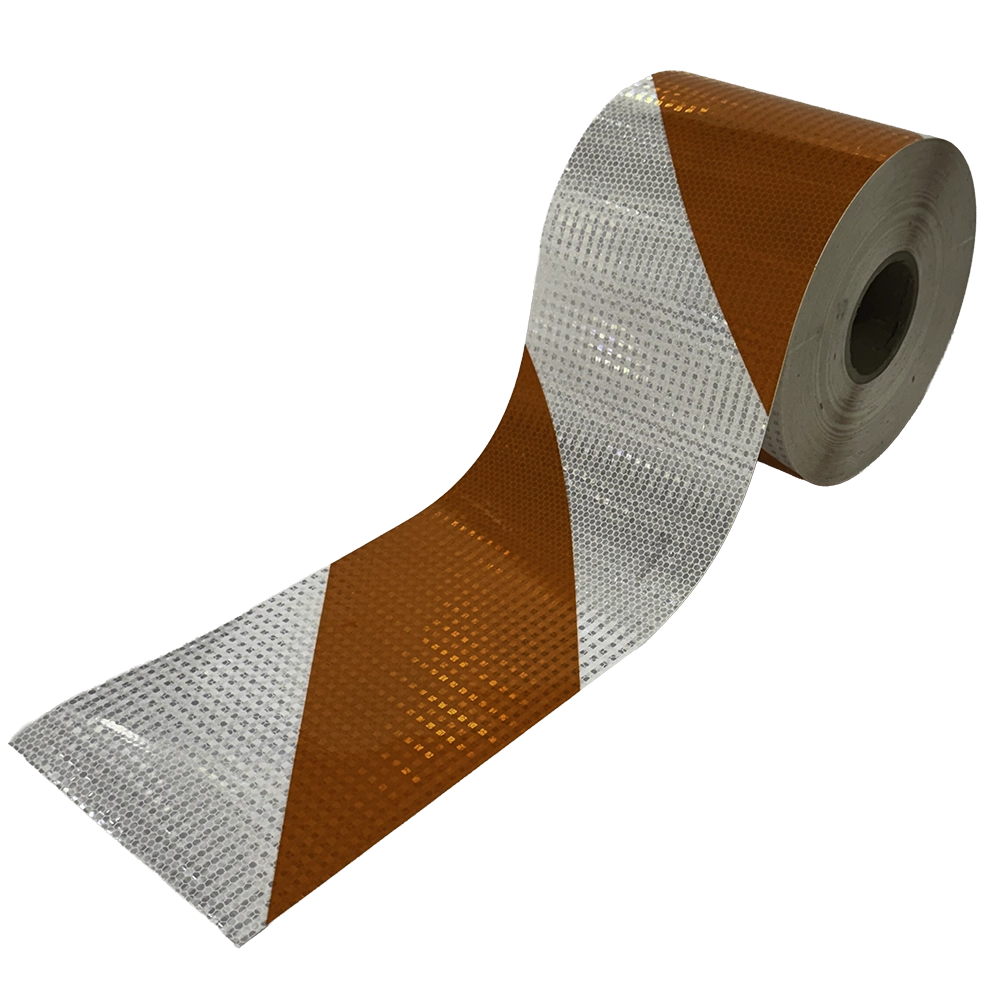A product photograph of a 7.75-inch by 100-yard roll of orange-and-white diagonally striped high intensity prismatic reflective barricade sheeting, partially unrolled to display the alternating stripe pattern. This self-adhesive retroreflective material is applied to traffic barricade rails to meet MUTCD Part 6K requirements for alternating orange and white stripes at a 45-degree angle. Available in left or right stripe orientations, the sheeting provides superior nighttime retroreflectivity for work zone barricade visibility.