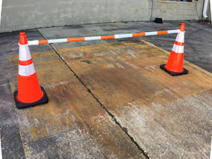 A large stack of custom traffic cones that is ready for shipment