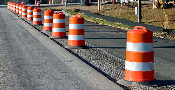 A row of channelizer drums in a workzone