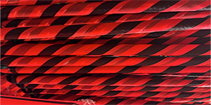 A large numbe of roll-up signs that are all groups together in a stack