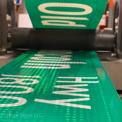 A street name sign being made
