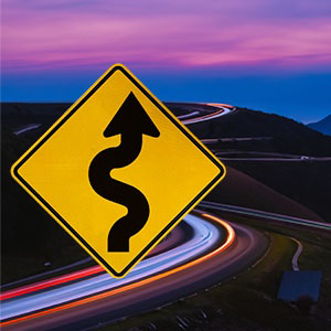 Picture of a winding road sign