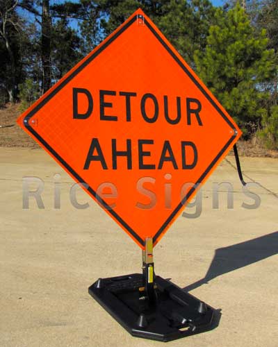 Reflective Roll-up 36" x 36" Detour Ahead Sign pictured below with optional RURubber Sign Stand. The Detour Ahead Roll-up Sign provides advance warning of a road closure or a detour.