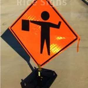 Flagger ahead roll-up sign shown with optional RURubber sign stand.