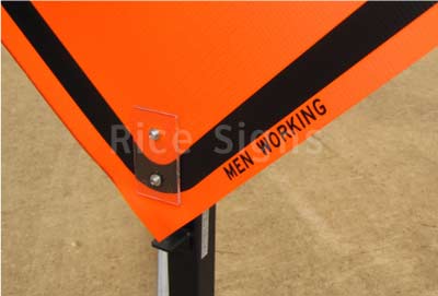 The words "MEN WORKING" are printed in the margin of the roll-up sign for easy identification.