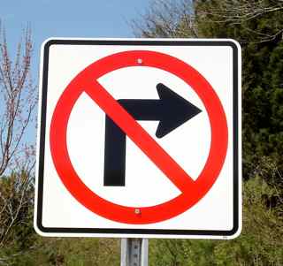 A picture of our No Right Turn traffic sign on an optional galvanized steel u-channel traffic sign post.