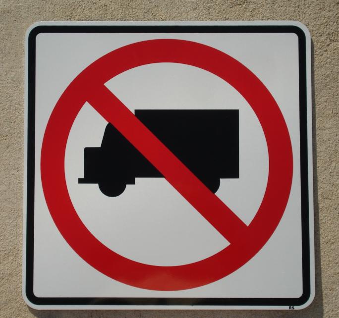 Up close picture of our No Trucks road sign.