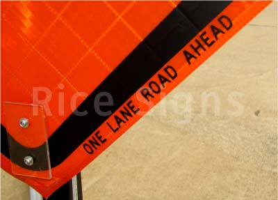 One Lane Road Ahead roll-up sign up-close photo.