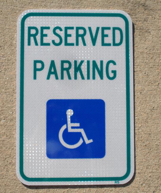 Up-close picture of our reserved handicap parking spot sign