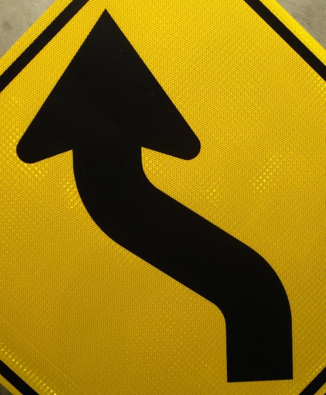 Up-close picture of our reverse curve left road sign