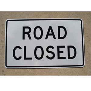 Our Road Closed sign is shown in the photo. The road closed sign is 48" wide and 30" tall.