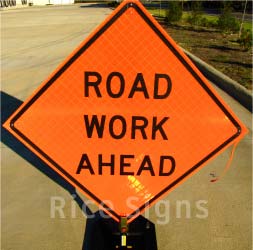 Pictured: 36"x36" Reflective Road Work Ahead Roll-Up Sign with Optional Rubber Sign Stand