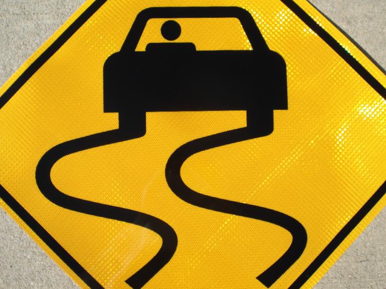 Up-close picture of our Slippery When Wet highway sign.