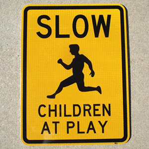 Pictured: Our 18"x24" Slow Children At Play street sign. The Slow Children At Play street signs are reflective at night.