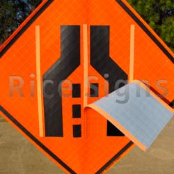 Our Double Transition Symbol Roll-Up Sign allows for the sign display that either the right or left lane is closed.  The Velcro overlay easily and securely attaches to the sign face.