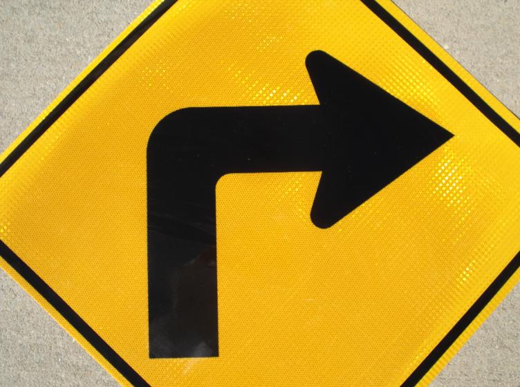 Our Right Turn in road sign is pictured.