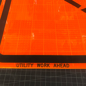 Our Utility Work Ahead roll-up signs feature screen printed text in the border, so that when it is rolled up you can see UTILITY WORK AHEAD printed in the margin for easy identification. Velcro can also be applied around around the word AHEAD. This allows overlays with different messages to be used to change the distance. For example, with the 1500 FT overlay, you could change the message of the sign to Utility Work 1500 Ft.