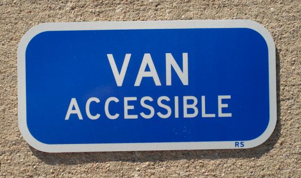 Actual photo of our Van Accessible handicap parking sign (blue/white style).