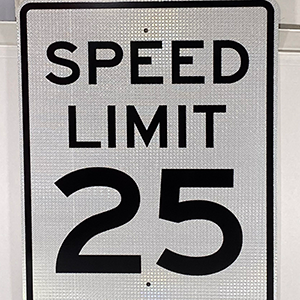 A speed limit 25 mph with holes drilled in the top and bottom of the sign. Great for any HOA.