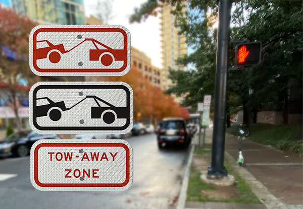 Four different styles of tow away signs 